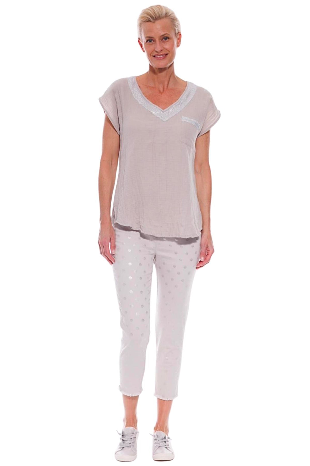 Woman wearing foil spot capri jeggings in stone, sold and shipped from Pizazz Boutique online women's clothes shops Australia
