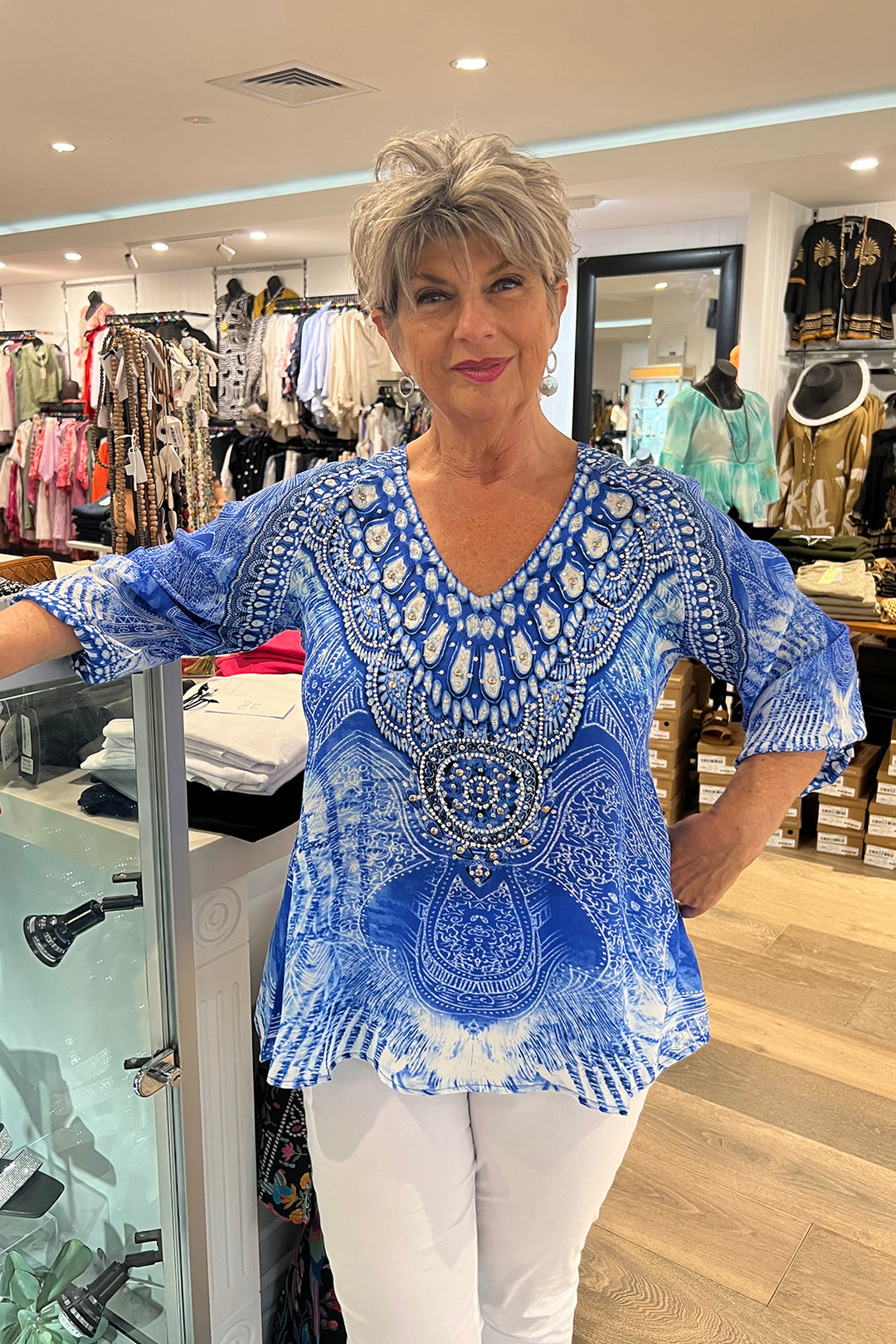 Woman wearing a silk top by Fashion Spectrum, Sold and shipped from Pizazz Boutique Nelson Bay women's dresses online Australia