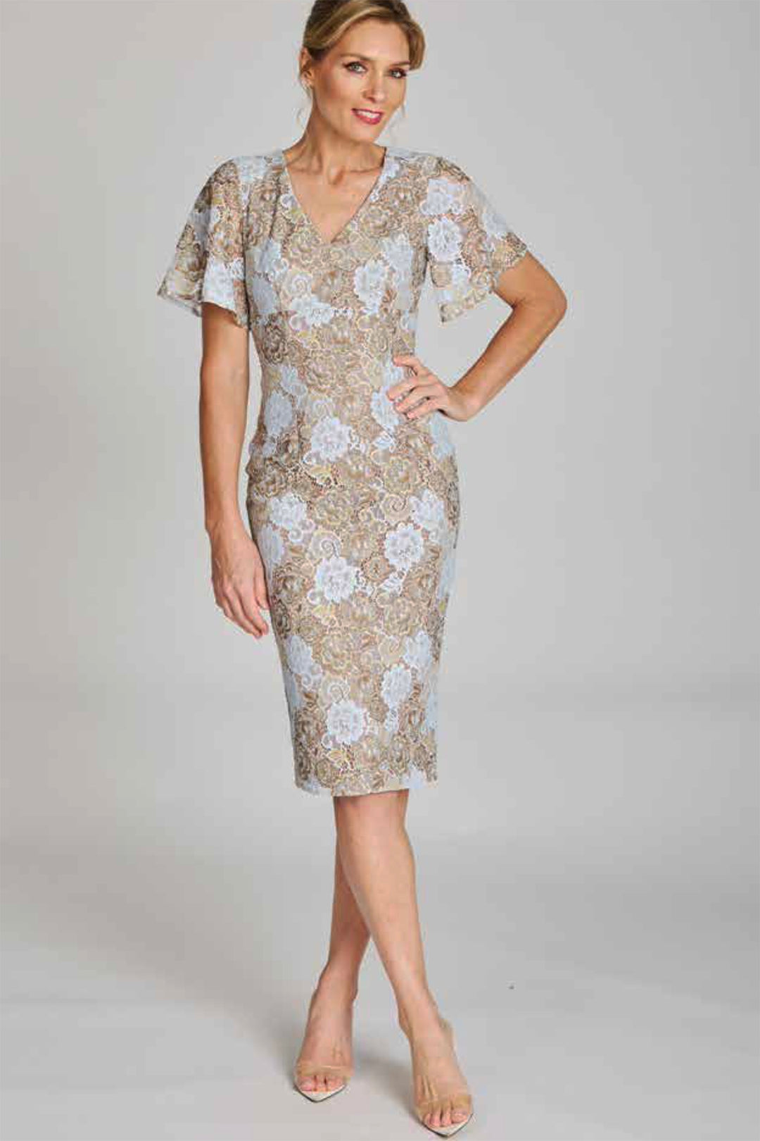 Front View of a lady with a V-neck in a delicate lace dress and flowing sleeves in a midi length designed by Pink Ruby and purchased from PIzazz Boutique Nelson Bay dress shops