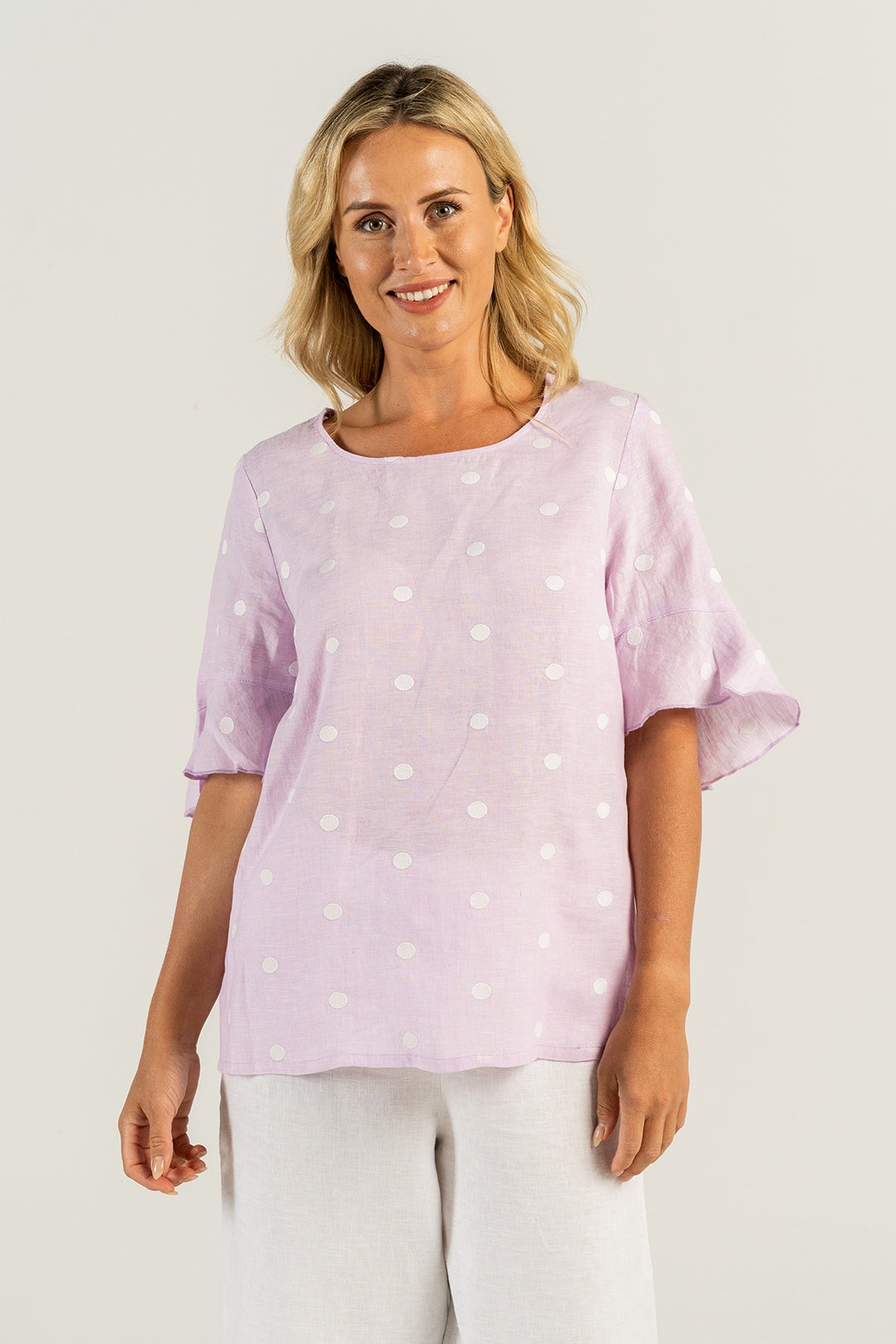 Woman wearing a linen spot flutter shirt by See saw clothing, sold and shipped from Pizazz Boutique Nelson Bay online women's clothes shops Australia