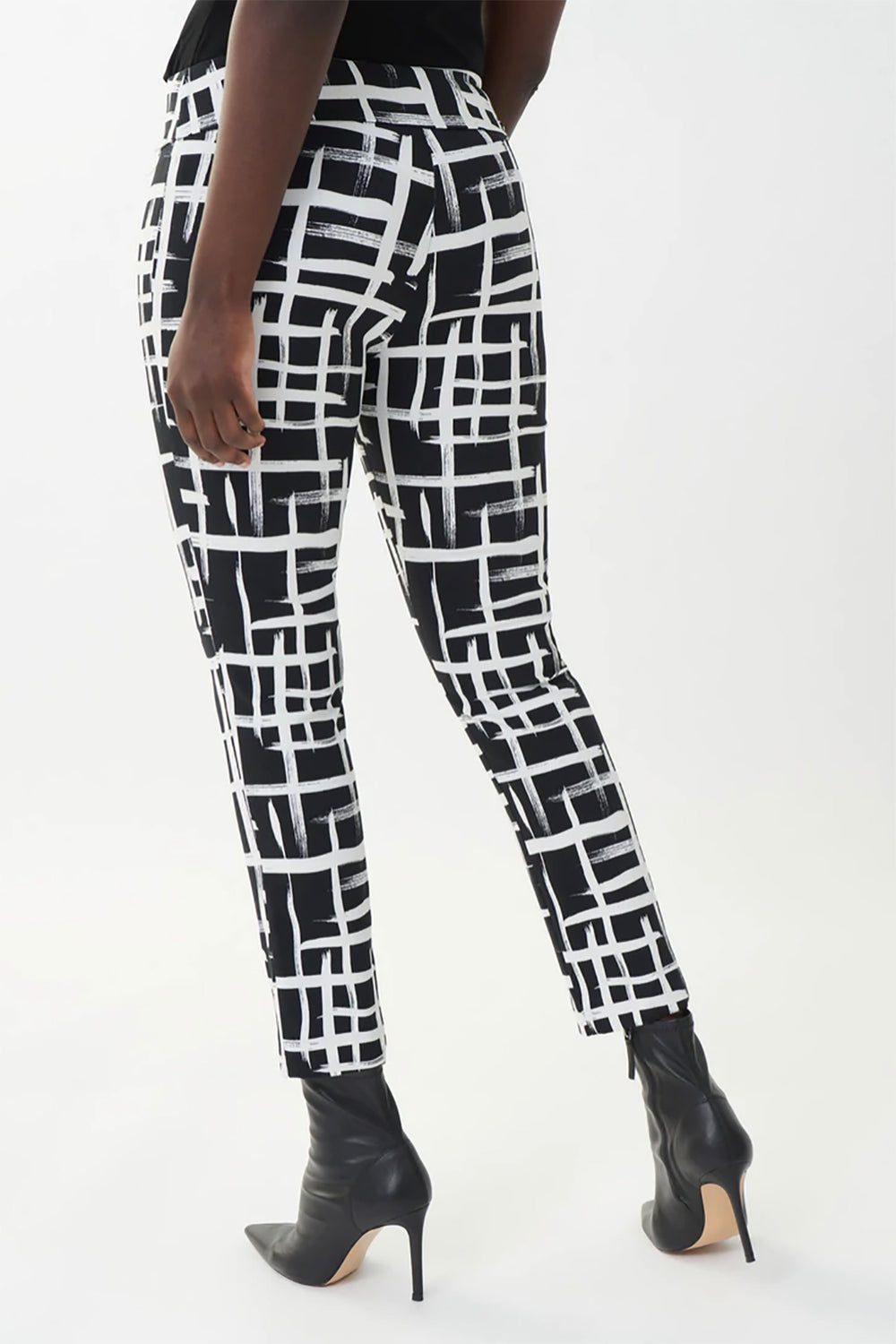 Woman wearing the block inspired pant in black & white by Joseph Ribkoff, sold and shipped from Pizazz Boutique Nelson Bay women's dresses online Australia