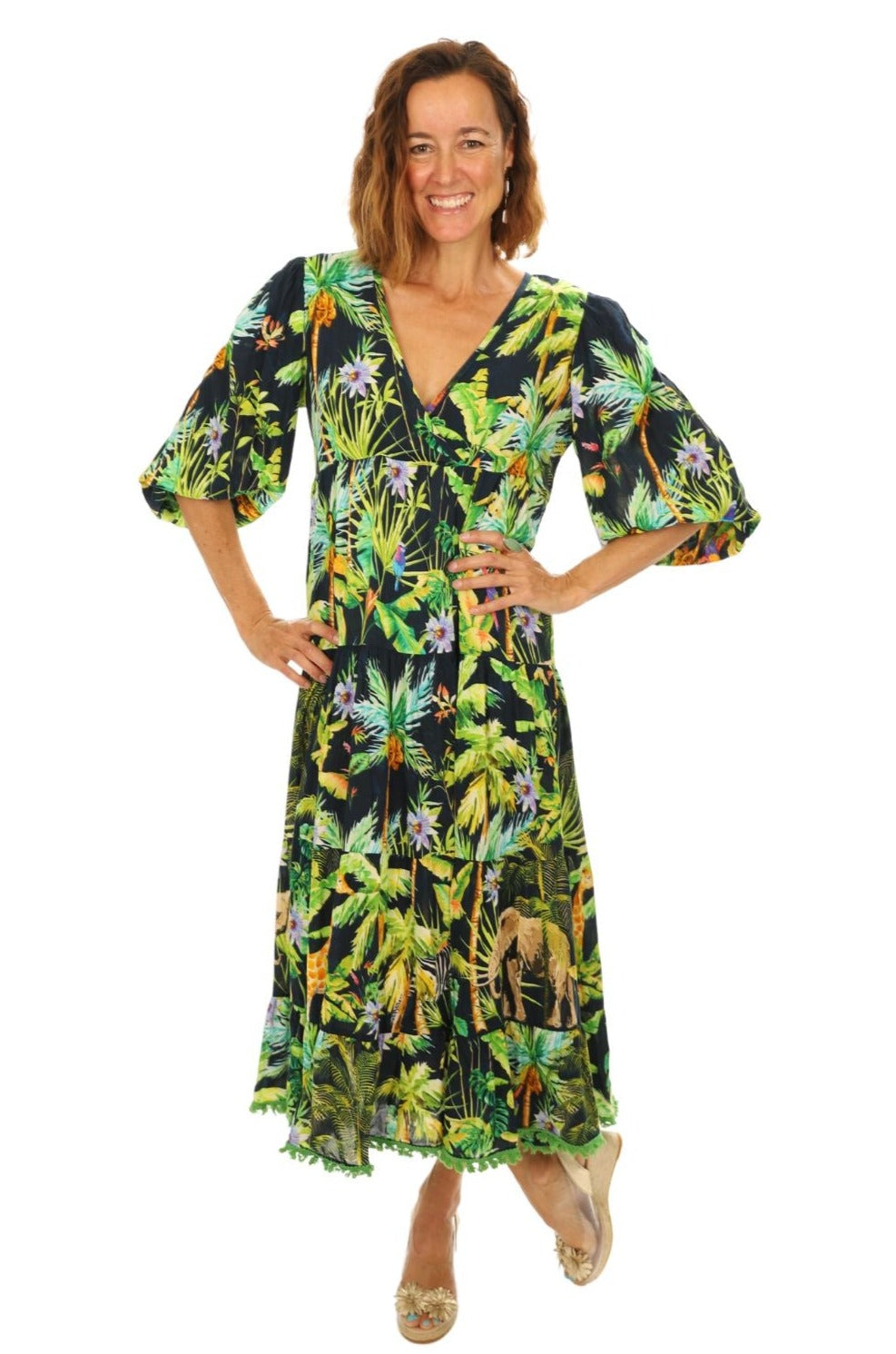 lady wearing long bright colourful jungle print dress , 7/8 sleeves, V-neck 