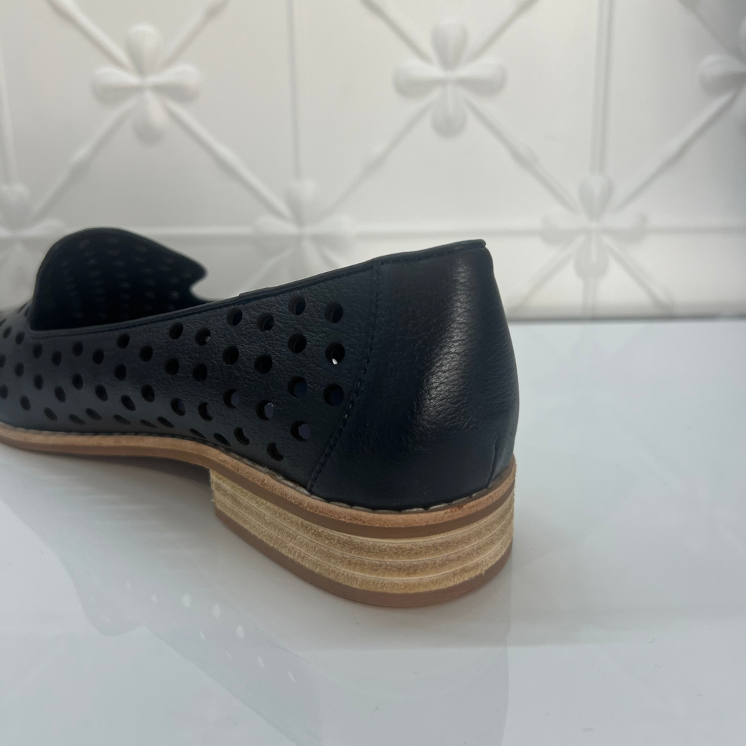 Navy perforated shoe with a wooden sole on a white background
