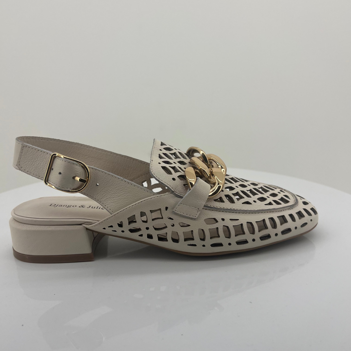Ivory sandal with cut-out design and gold buckle on a white background