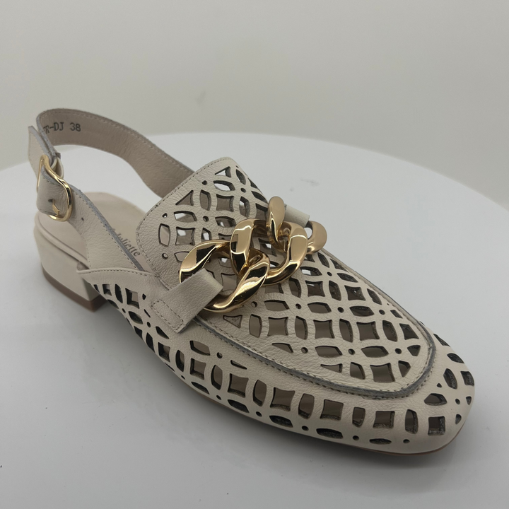 Ivory sandal with gold chain on a white background