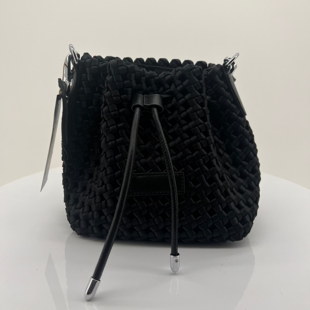 Black textured handbag on a white background