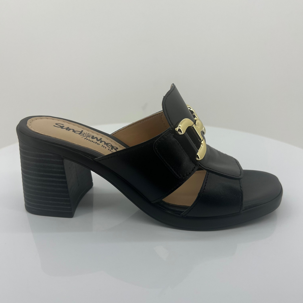Black sandal with gold buckle on a white background