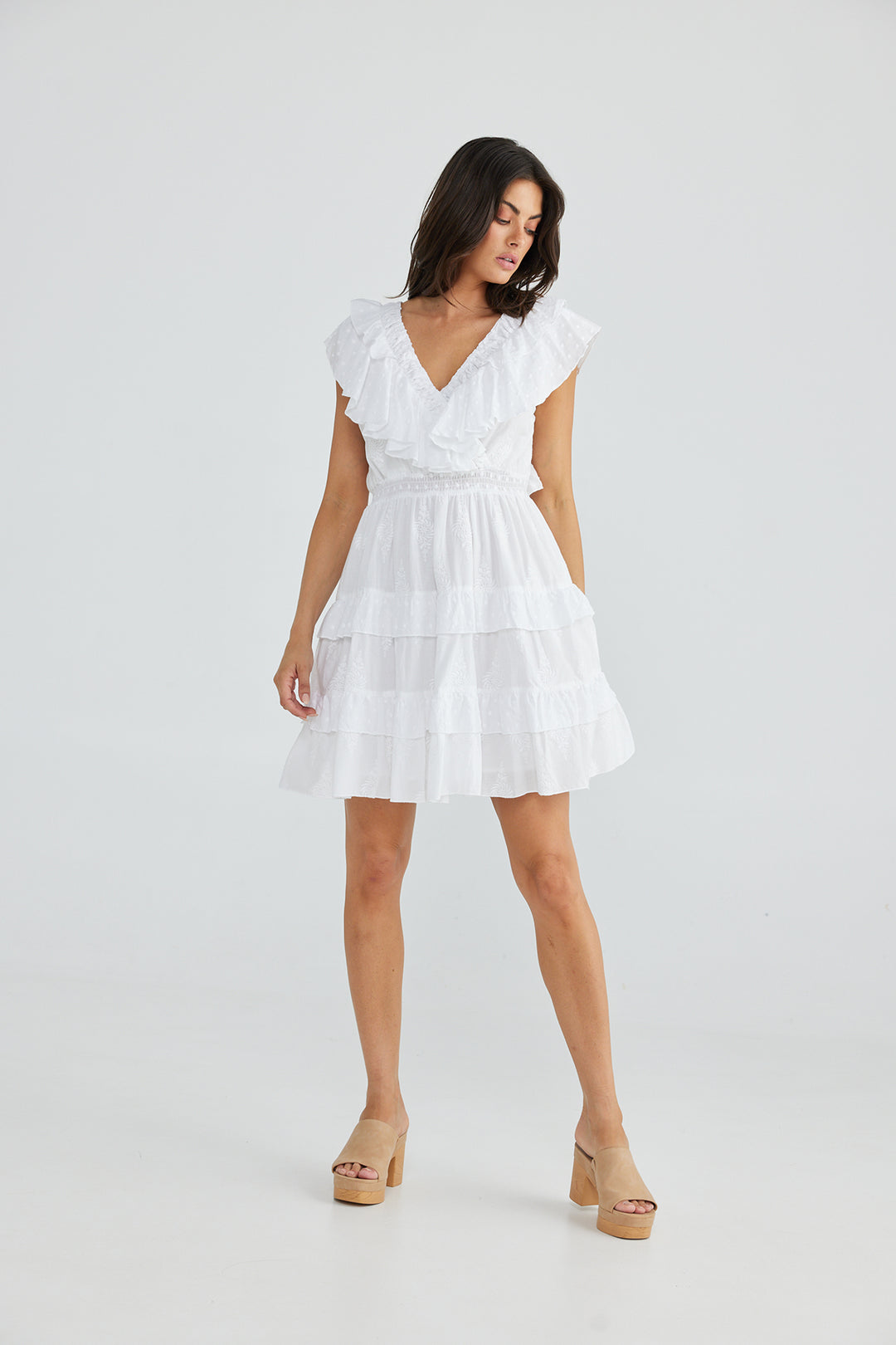 woman wearing a white dress with a V-Neck by Talisman, sold and shipped from Pizazz Boutique online women's clothes shops Australia