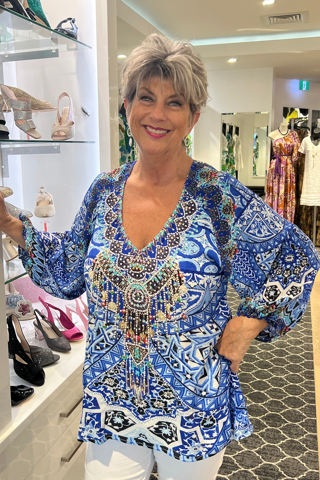 Woman wearing an Abaza Gypsy Top in Flora by Fashion Spectrum,sold and shipped from Pizazz Boutique Nelson Bay Women's clothing store online Australia