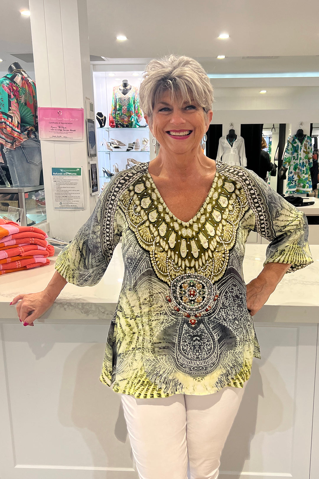 Woman wearing an Amalfi gypsy top in khaki, sold and shipped from Pizazz Boutique Nelson Bay women's dresses online Australia
