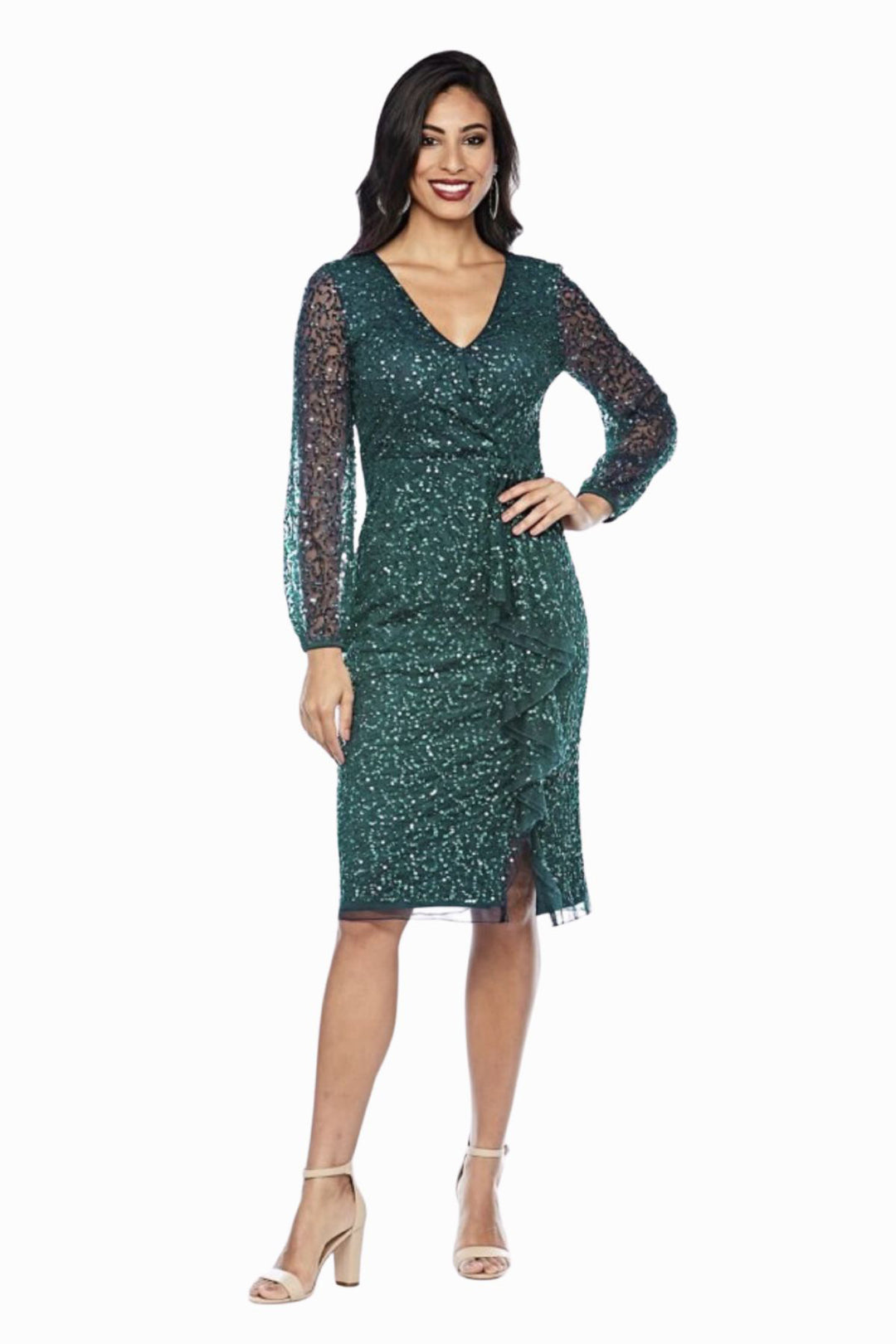 Woman wearing a green sequenced dress from Zaliea Australia with long sleeves and tan chunky heels from Pizazz Boutique Nelson Bay dress shops 