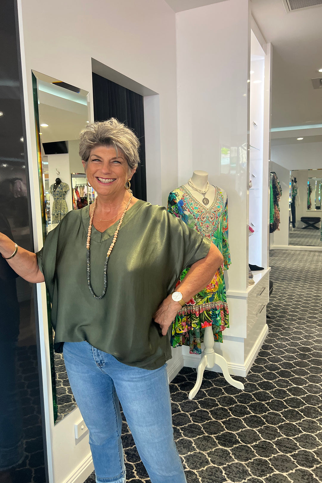 Woman wearing a silk top by Cindy-G, sold and shipped from Pizazz Boutique online women's clothes shops Australia
