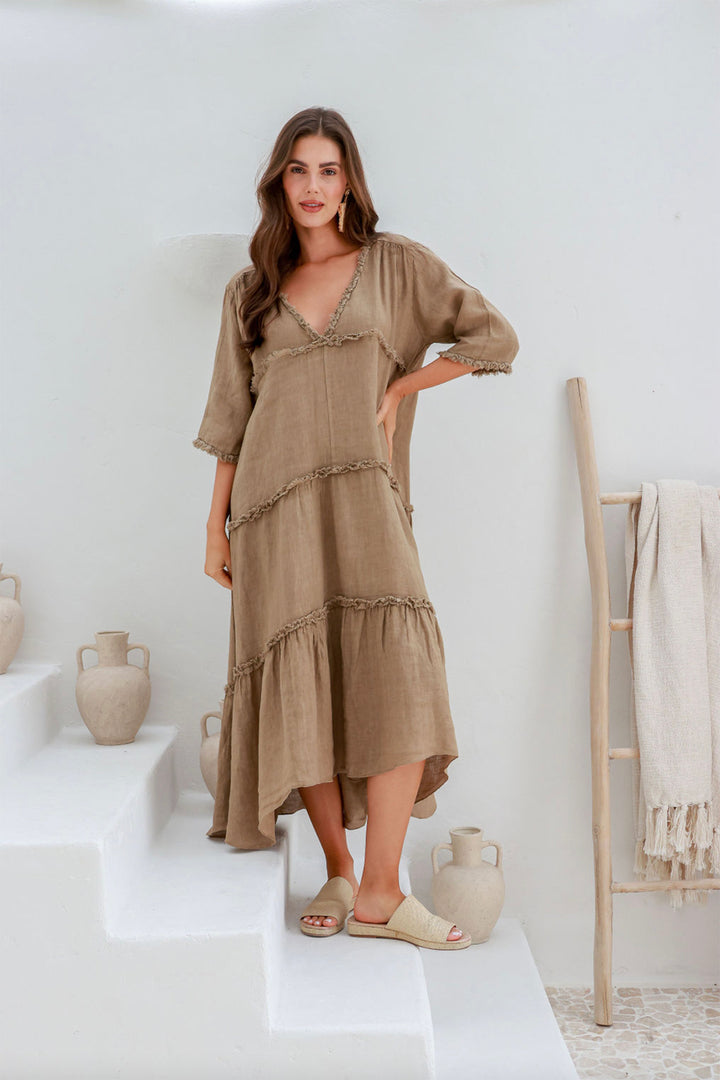 Woman wearing 100% linen dress with a V-neck by The Italian Cartel, sold and shipped from Pizazz Boutique online women's clothes shops Australia front view