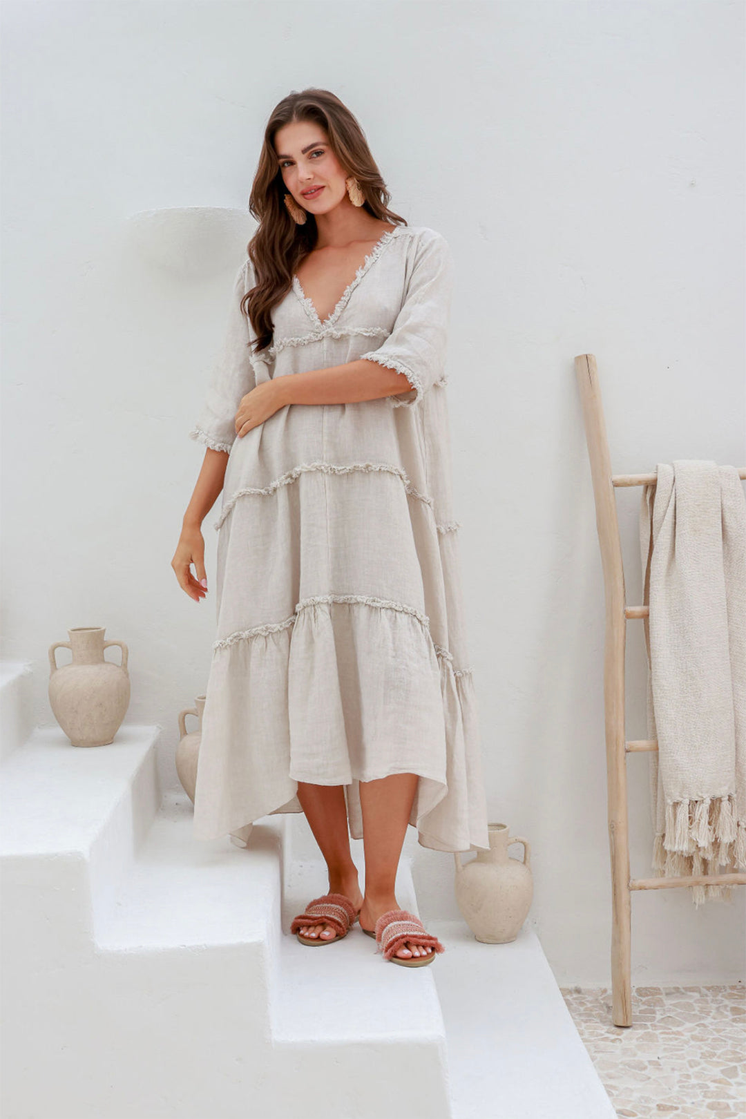 Woman wearing 100% linen dress with a V-neck by The Italian Cartel, sold and shipped from Pizazz Boutique online women's clothes shops Australia front view