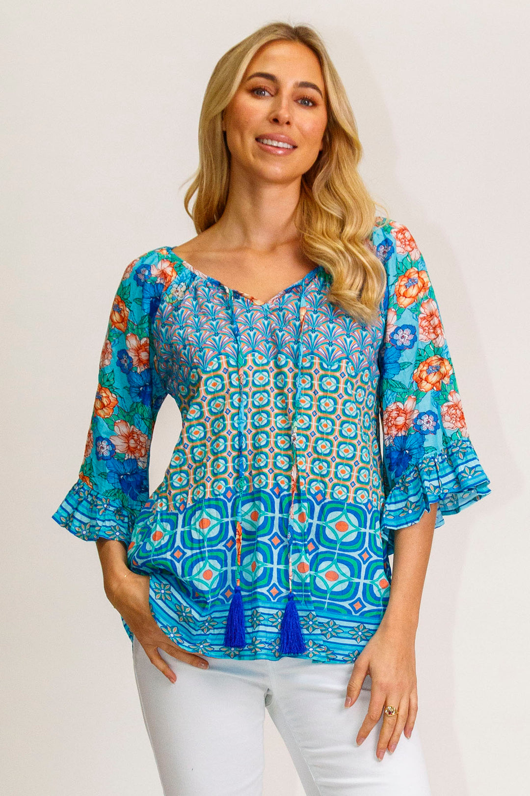 Woman wearing the LulaLife lorne top in Ocean from Pizazz Boutique