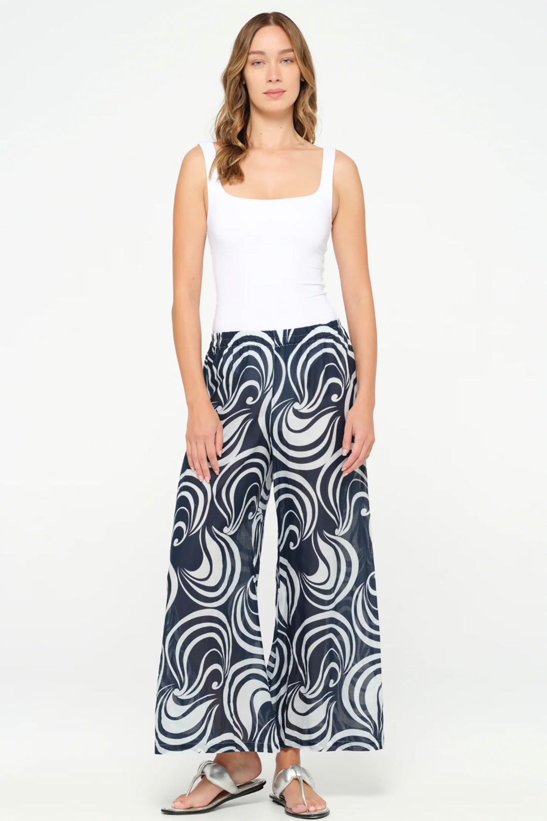 Photo of lady standing in Palazzo pants baros-cotton-white by Oneseason Australia.