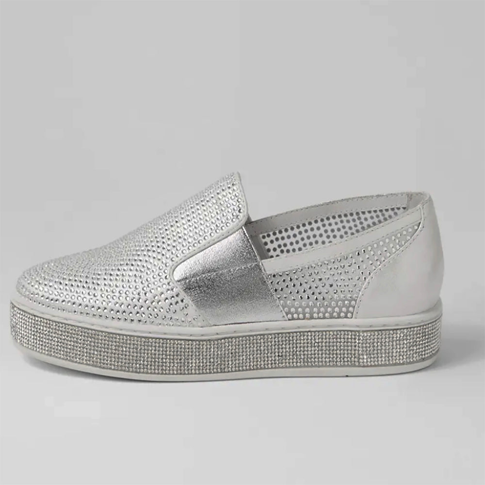 Side view of a silver loafer with diamonte detailing on the side and around the soul from PIzazz Boutique Nelson Bay dress shops