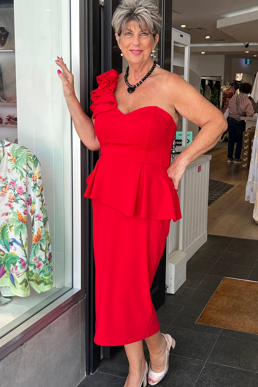 Woman wearing the Ruby Peplun Dress by Zaliea, sold and shipped from Pizazz Boutique online women's clothes shops Australia
