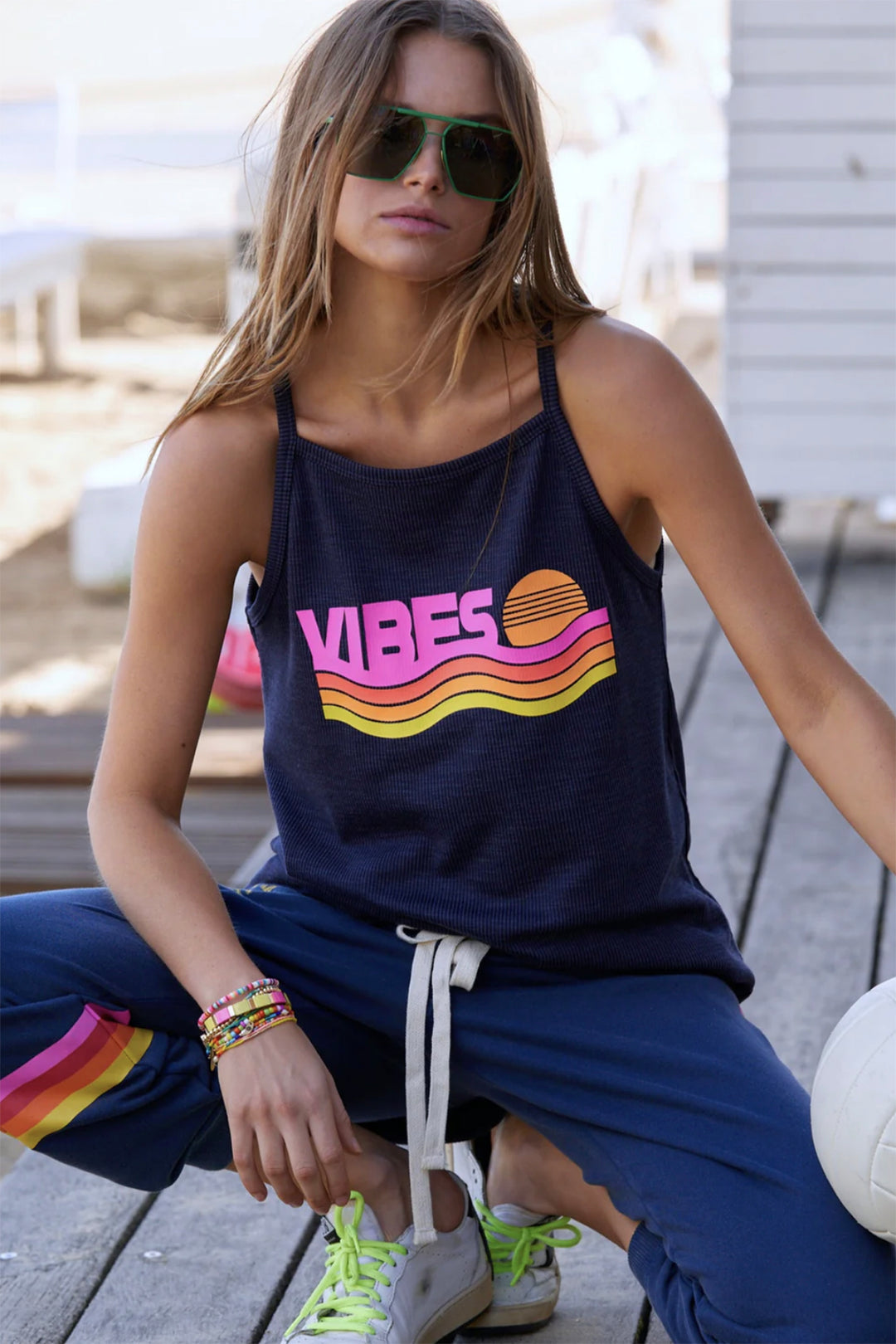 Woman wearing a navy vibes rib tank by Hammill + Co, sold and shipped from Pizazz Boutique online women's clothes shops Australia