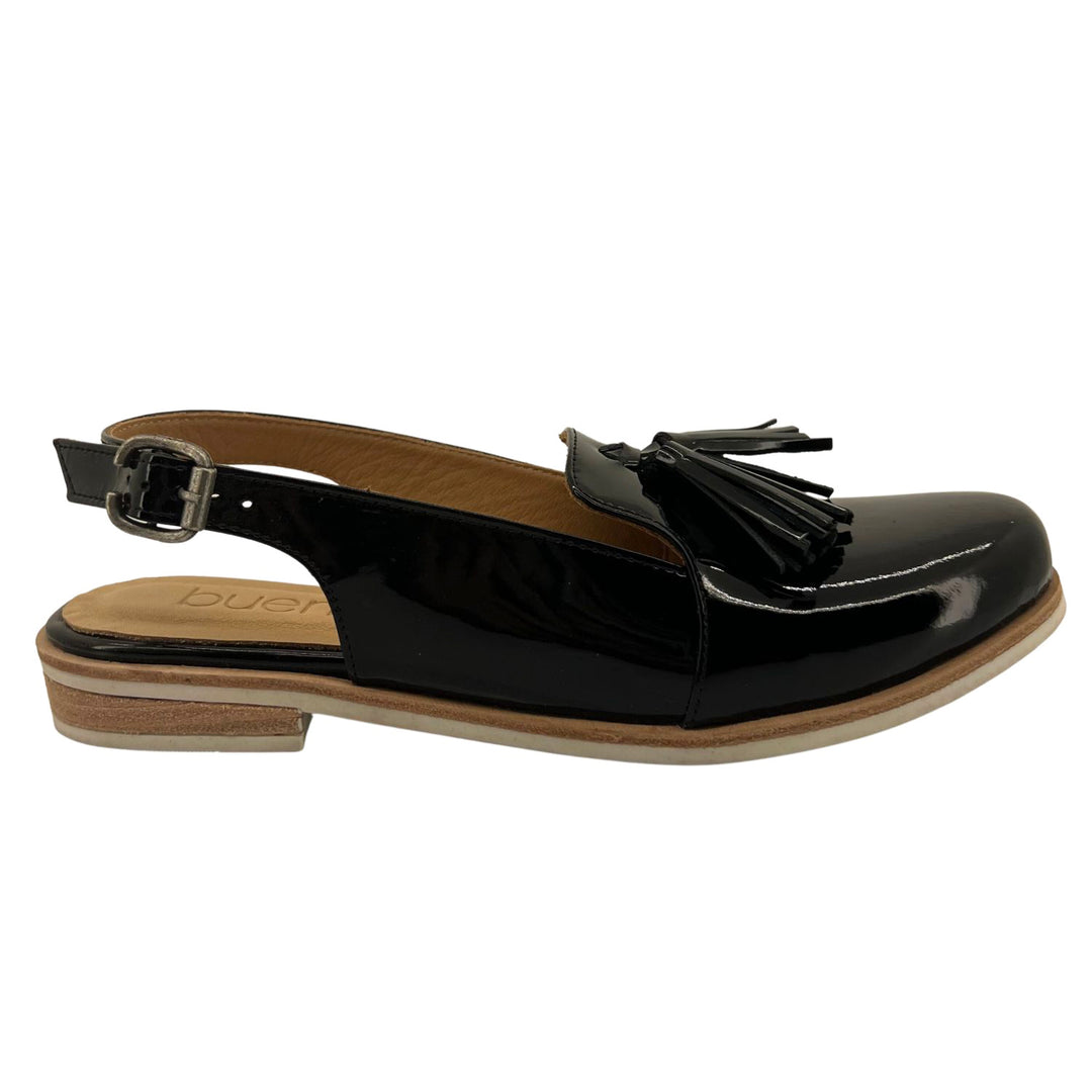 The Pella Slingback by Bueno features a round toe and loafer-like design with a sling back adjustable strap. The low heel is perfect for an all day weekend wear and will be your new favourite piece this season. Brand : Bueno Style Code : PELLA Colour : Black Patent  Leather lining and upper  Buckle on the side Tassel detail 