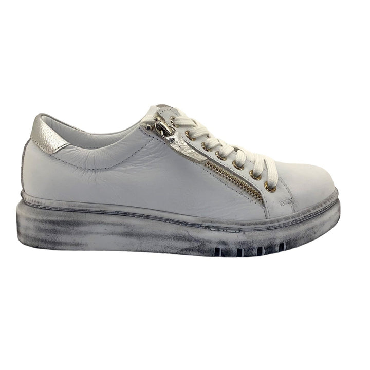 Rilassare offers superb comfort and style. These Tatter Sneakers in White leather are designed and made in Europe. The Tatter Sneaker is perfect for with jeans and pants. They offer an easy fit with a Silver zip closure and a modern feel