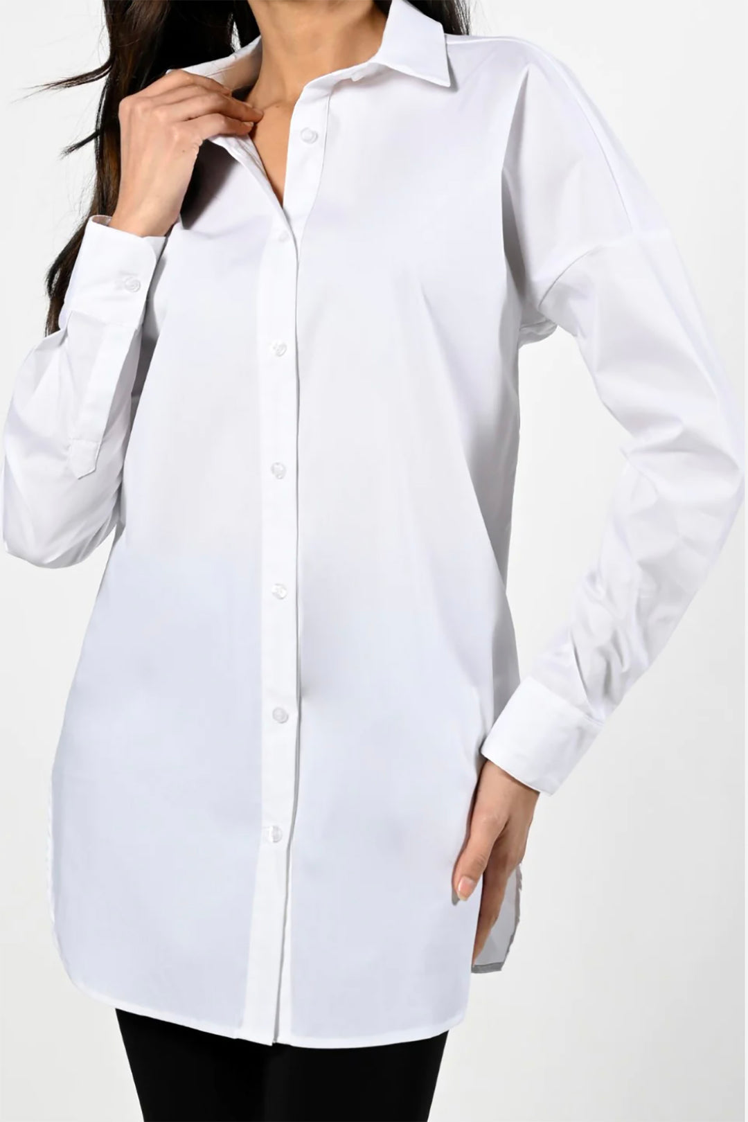 Woman wearing the Bianca shirt by Frank Lyman in white, sold and shipped from Pizazz Boutique