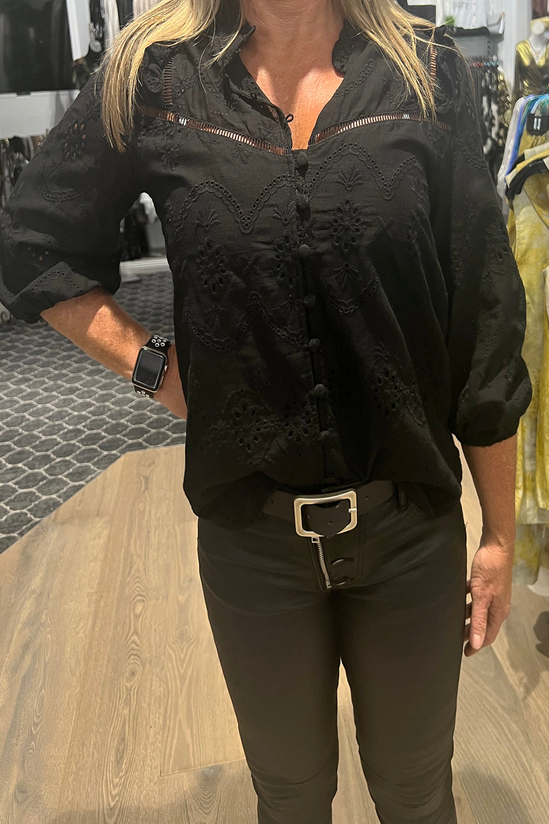 Woman wearing a black blouse, sold and shipped from Pizazz Boutique Nelson Bay women's dresses online Australia