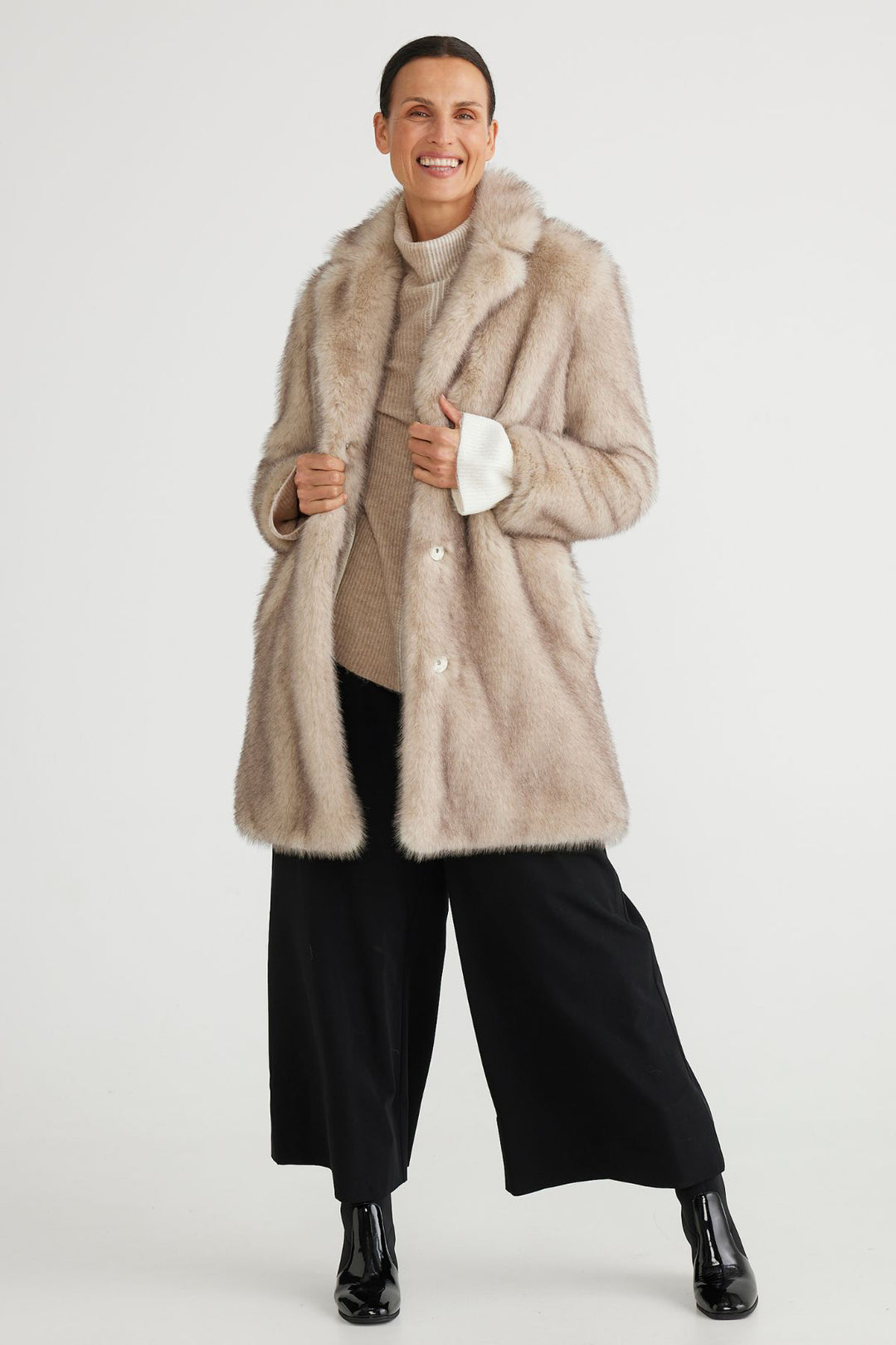 Brand Brave & True  Style BT6766-2 Colour Ashy Fleck  100% Polyester  The perfect mid length jacket  Faux Fur  Snap covered buttons for closure Pockets  Fully Lined 