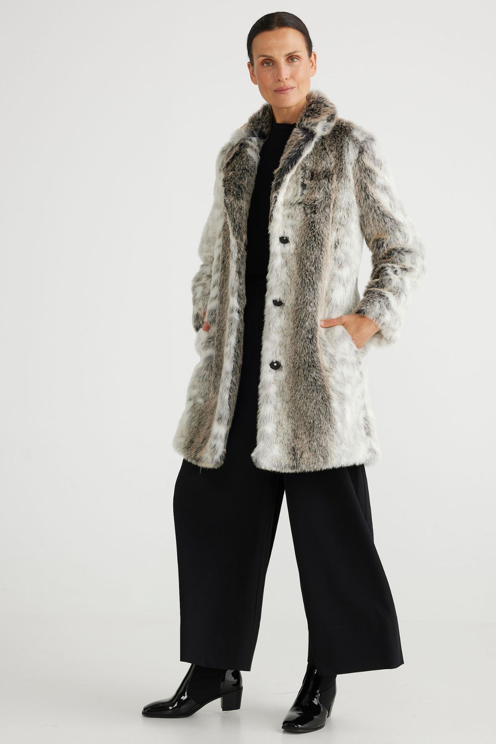 Brand Brave & True  Style BT6766-2 Colour Fawn 100% Polyester  The perfect mid length jacket  Faux Fur  Snap covered buttons for closure Pockets  Fully Lined 