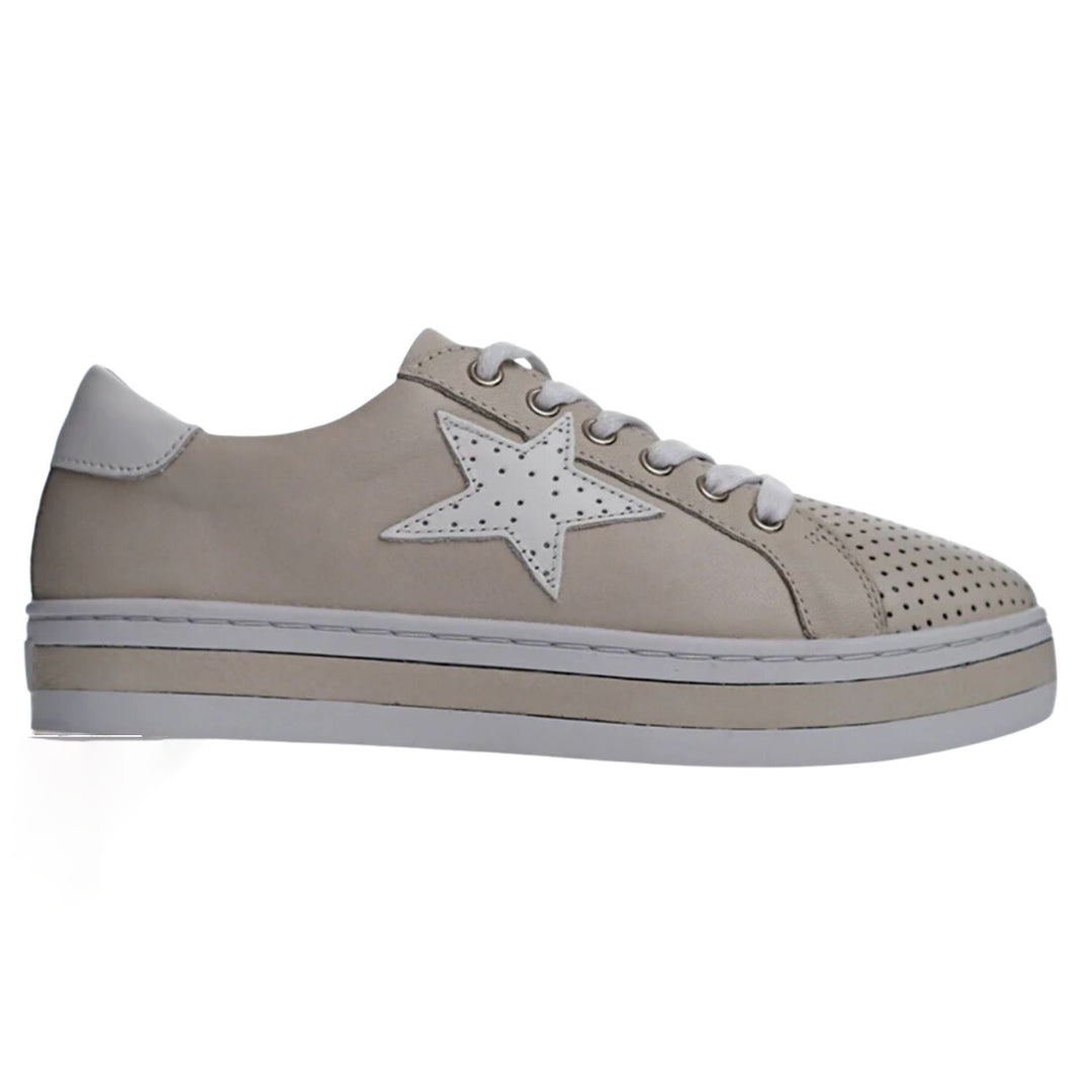 The best selling Pixie Sneaker by Alfie & Evie is a classic combo of pale stone leather and a leather white star. The Pixie Sneaker features a star trimmed sneaker upper, soft Turkish leathers, a removable leather memory foam sock and a durable rubber platform sole.  Brand : Alfie & Evie Style Code: Pixie Colour: Stone/White Material: Leather Lace up front Turkish Leather upper  Outsole -rubber Platform sneaker  Removable Arch Support Leather & Memory Innersole 
