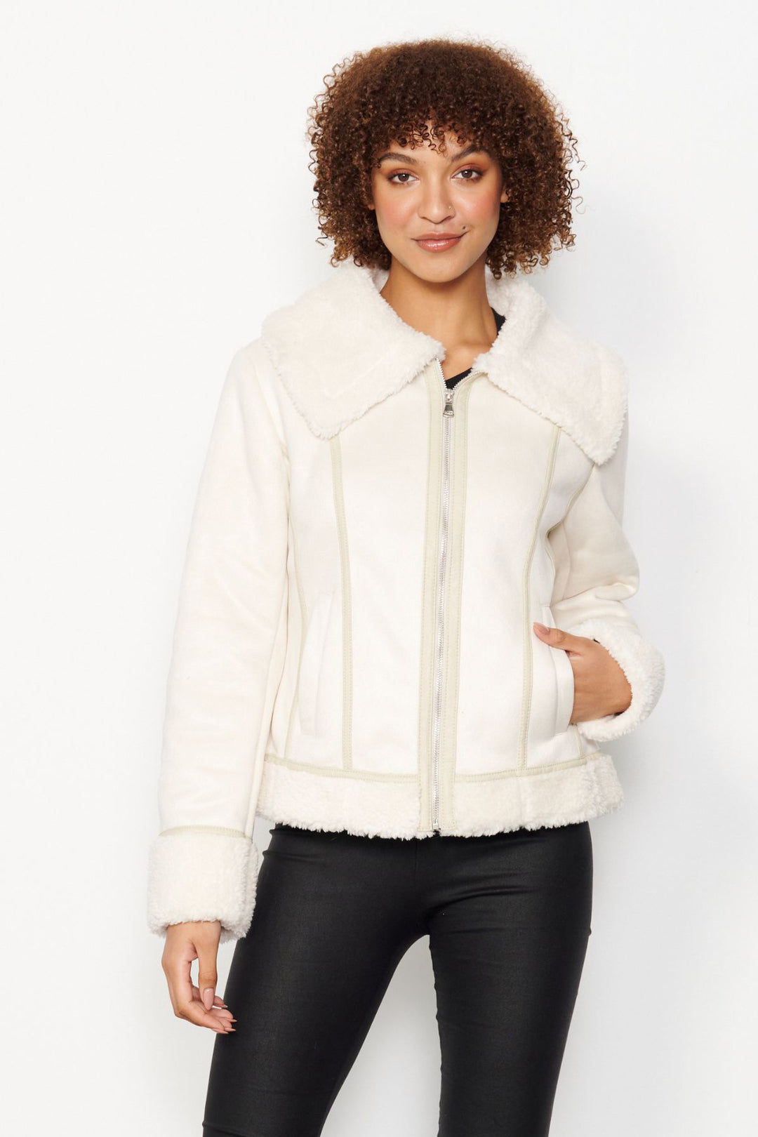 The Sherpa Jacket by CAJU is made for winter. This fitted jacket is wooly on the inside