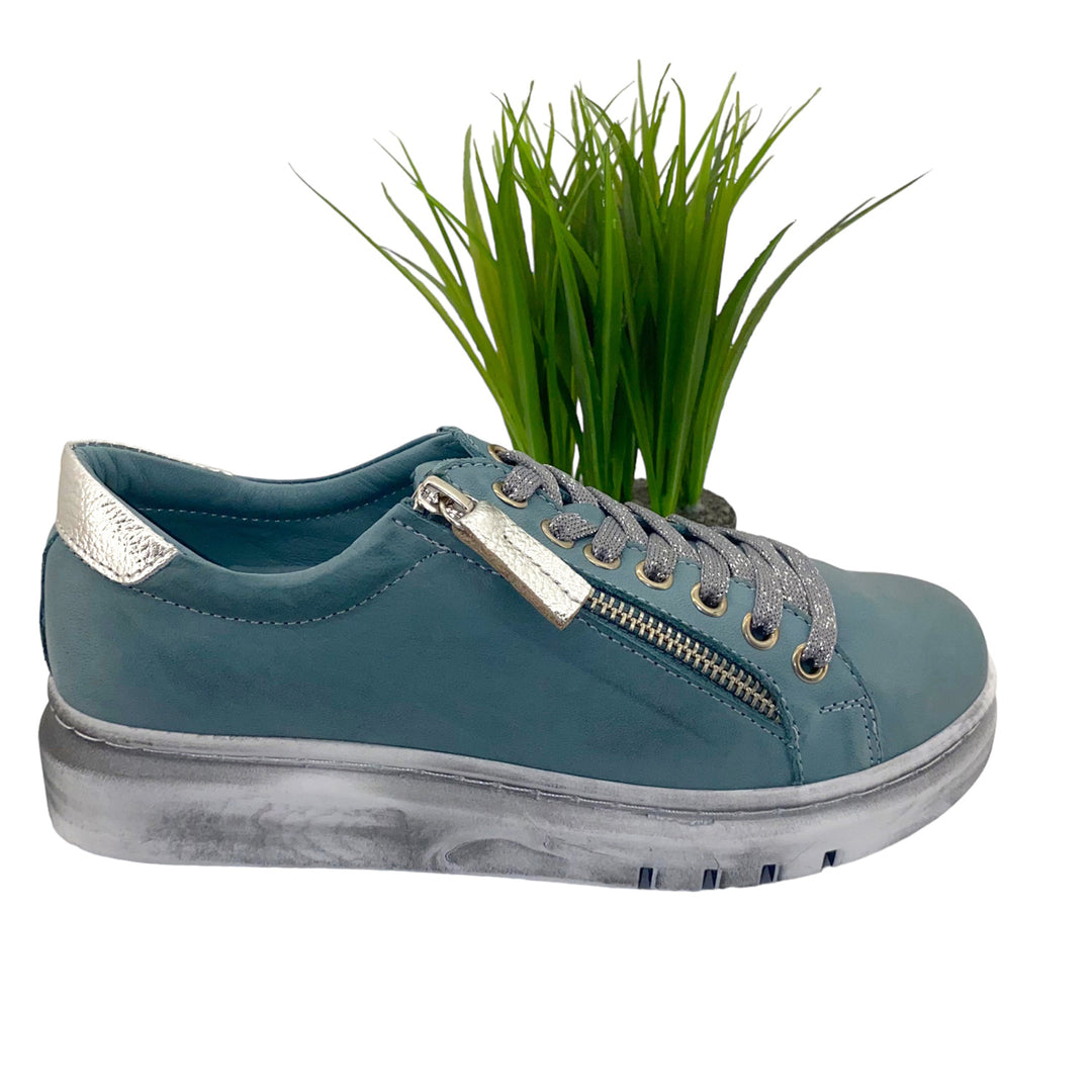 Rilassare offers superb comfort and style. These Tatter Sneakers in petrol colour leather are designed and made in Europe. The Tatter Sneaker is perfect for with jeans and pants. They offer an easy fit with a Silver zip closure and a modern feel.