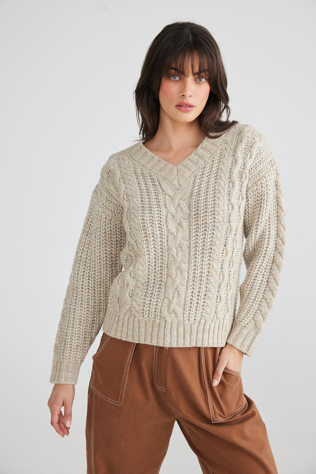 The Trixie Knit is a cute cosy knit the features a gorgeous cable knit pattern, this versatile knit is easy to wear and will update your season wardrobe.    Brand Talisman  Style TA23030-1 Colour Natural Marle 77% Acrylic 9% Nylon 6% Polybutylene Terephthalate  8% Wool  Cold Hand Wash 